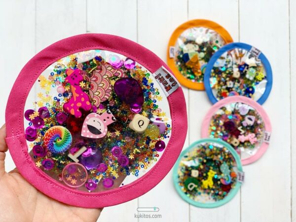 Caleidoscopio seguro con el borde rosa fucsia para el cesto de los tesoros Montessori